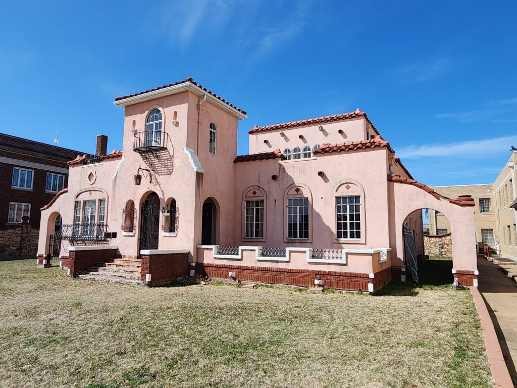"The Pink House", a historic pink color house in the Spanish Revival style. 